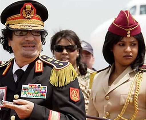 
	Muammar Gaddafi, pazit de The Amazonian Guard - femei care-si risca viata pentru el FOTO
